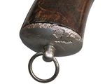 a small metal object with a ring on it