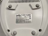 a white smoke detector on a white table