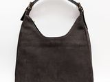 a black purse with a gold handle on a white background