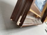 a close up of a picture frame on a desk with a keyboard