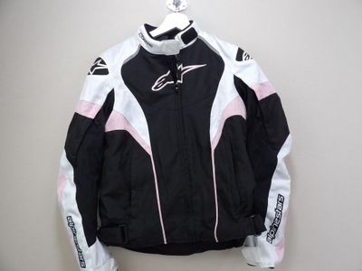 the jacket is black and white with pink accents on it