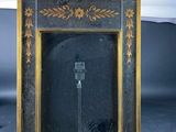 a picture of a clock that is on a wooden stand