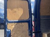 the back of a van with the door open showing the inside of the van