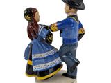ceramic figurine of a man and a woman in traditional clothing
