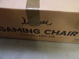 a box that has a gaming chair in it