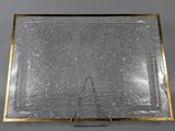 a close up of a glass tray on a metal stand