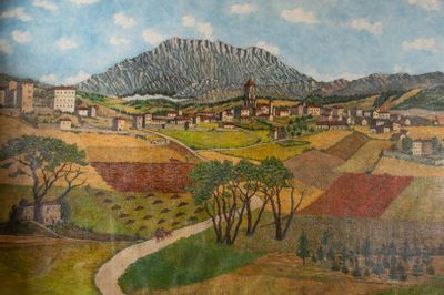 un tableau représentant un village avec une montagne en arrière-plan