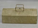 a small metal box with a handle on it