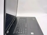 two laptops sitting side by side on a white surface