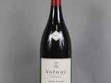 a bottle of wine that is sitting on a table