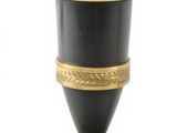 an image of a black and gold vase on a stand