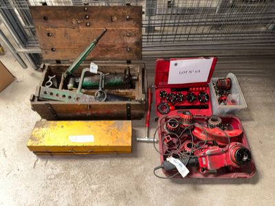 a box of tools sitting on the floor next to a box of tools