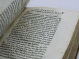 an open book that is sitting on a table