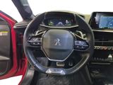the interior of a car with a steering wheel and dashboard controls