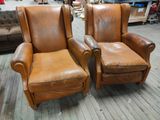 pair of leather recliners with matching foot rest and foot rest
