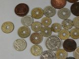 a lot of coins that are on the table