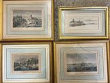 four framed prints of a river scene with a castle in the background