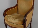 an image of a chair with a cushion on it on a grey background