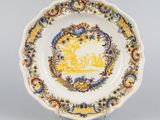 a close up of a plate with a yellow and blue design on it