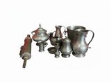 a lot of silver items that are on a white surface