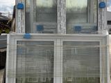 two windows that are sitting on top of a truck