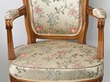 an image of a wooden chair with a floral upholstered seat
