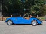 a blue car parked on the side of the road