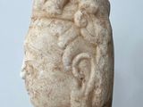 sculpture of a head of a man with a short beard