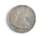 an old silver coin with a woman ' s face on it