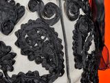 black and white lace on a dress with a red background
