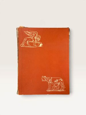 an orange book with a drawing of a man and a dog