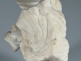 an image of a statue of a person holding a fish on a wooden base