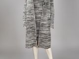 a black and white striped coat and dress on a mannequin mannequin mannequin mannequin mannequin mannequin mannequin mann