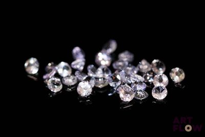 some very pretty white diamonds on a black surface