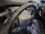 a steering wheel in a car with a remote control
