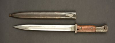 two knives that are laying side by side on a table