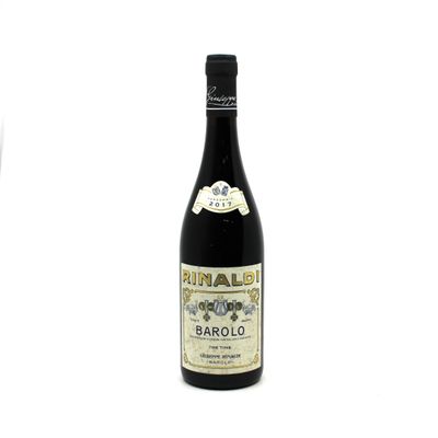 a bottle of wine sitting next to a glass of wine