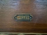 a close up of a wooden table with a sign on it