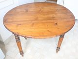 a wooden table with a wooden top in a kitchen