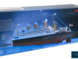a box with a model of a large ship in it