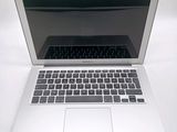 a laptop computer that is sitting on a white table