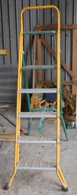 a ladder that is sitting in the middle of a room