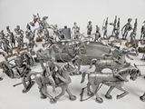 many figurines of different types and sizes on the table