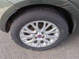 a close up of a car ' s tire on the road