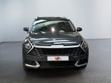 the front view of a black car in a showroom