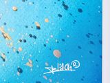 a picture of a picture of a blue sky with gold dots