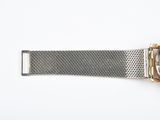 an image of a close up of a wrist watch on a white surface