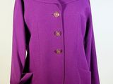 purple coat on a mannequin dummy on a white background