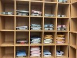 a closet with a lot of clothes on the shelves
