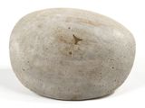 a stone with a star on it sitting on a white surface